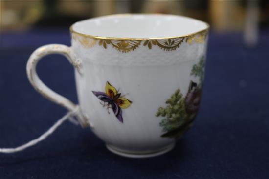 A Berlin cup and saucer, painted with birds and insects